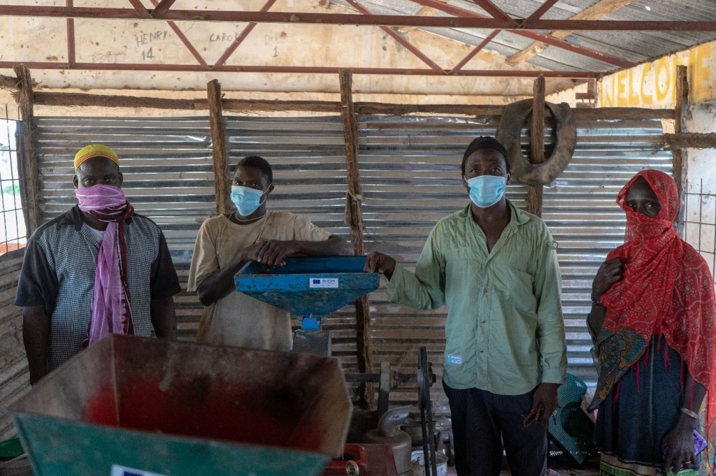 In Kundam, the resources earned from the multi-purpose milling machine are helping the community extend a water pipeline that provides fresh water for all. © IOM 2021/Alessandro Lira